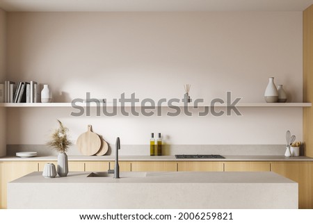 Interior with double sided kitchen cabinet. Marble and wooden details, shelf in the upper part, stove, low splashback, kitchenware on the worktop and sink opposite the light wall. 3d rendering