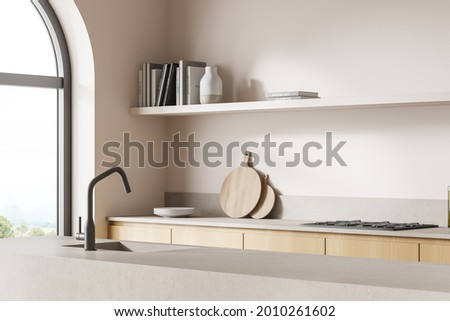 Corner view of kitchen interior with stone and wooden details, pinky walls, arch window and double sided cabinet with open shelf and sink opposite the stove. 3d rendering