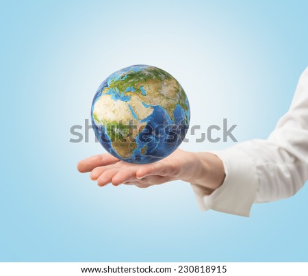Young female hand holding a globe. frica and Asia view. Elements of this image furnished by NASA  Foto stock © 