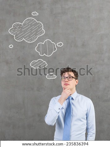 businessman thinking on concrete wall background