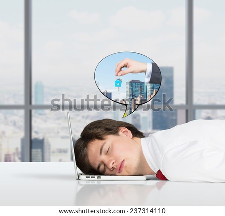 businessman sleeping on the job and dreams of sale real estate