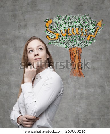 Young business woman is thinking of success way. A concept of success.