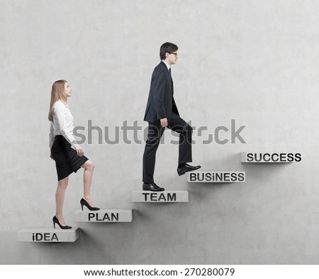 A couple is going up. A concept of the successful business team is making efforts at the career stairs.