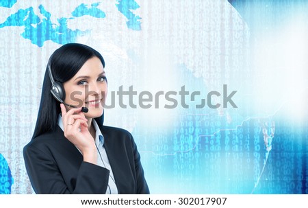 Brunette support operator in headset and digital world with binary code on the background. Elements of this image furnished by NASA.