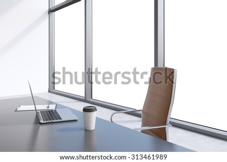 A workplace in a modern panoramic office with copy space in the windows. A grey table, brown leather chair. Laptop, writing pad and a cap of coffee are on the table. Office interior. 3D rendering.