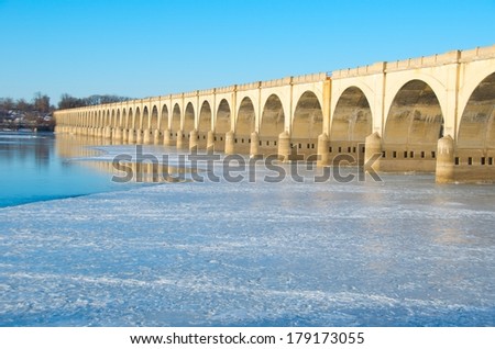 Harrisburg PA bridge in frigid weather with ice and sunny skies