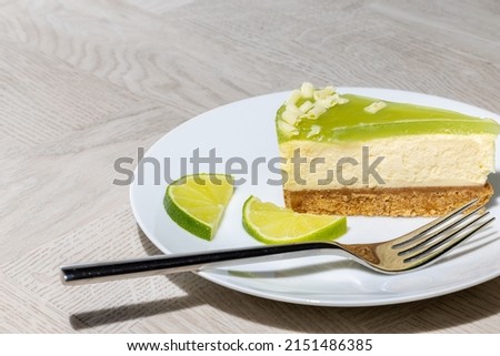 Similar – Image, Stock Photo Cheesecake slice with white chocolate topping. One slice of cheesecake close-up
