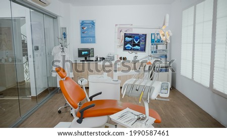 Empty stomatology orthodontist bright office room with nobody in it equipped with professional medical dentistry teeth instruments prepared for dental health surgery. Cabinet ready for tooth surgery Stockfoto © 