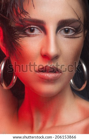 Girl with gothic make up and red color. Fashion and glamour style. Model. Head Shot. Red color