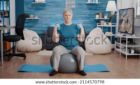 Similar – Image, Stock Photo Senior woman in sportswear jogging through the forest