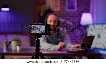 Similar – Image, Stock Photo Man filming a vlog with camera in the city