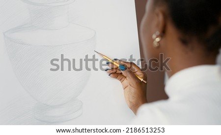 Similar – Image, Stock Photo Female artist drawing with pencil in art studio