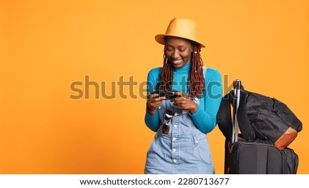 Similar – Image, Stock Photo Cheerful women playing videogame on couch