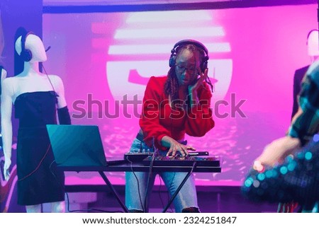 Similar – Image, Stock Photo DJ mixing music during party in club