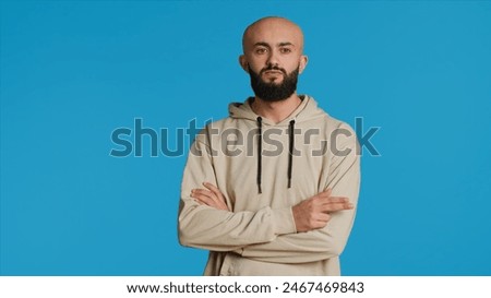 Similar – Image, Stock Photo Arabian man in blue clothes walking on a desert dune.