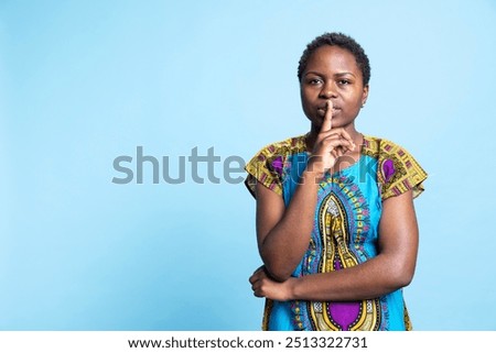 Similar – Image, Stock Photo Ethnic woman showing silence gesture in field