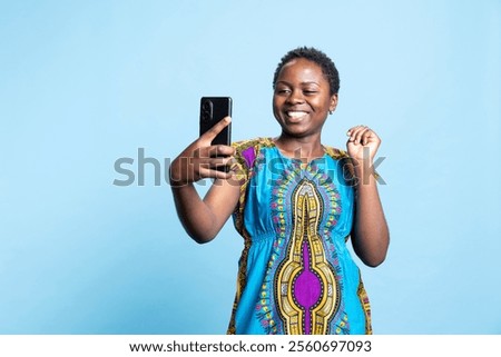 Similar – Image, Stock Photo Positive ethnic woman photographing on retro camera in city park