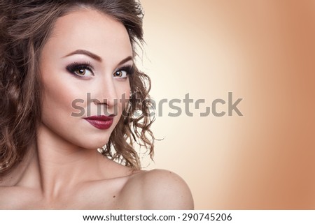 Gorgeous woman with professional make up on brown background. Studio shooting. Beauty and fashion. Professional make up. Salon and cosmetics