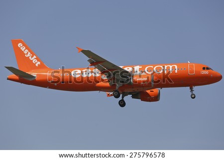 THESSALONIKI, GREECE - August 18, 2014: easy jet low cost airline, orange Airbus A320 aircraft landing at International Airport \'Makedonia\', Greece