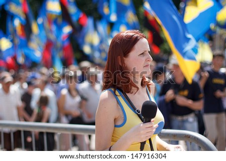 KIEV, UKRAINE - MAY 18: Unidentified journalist makes report with protesters of 