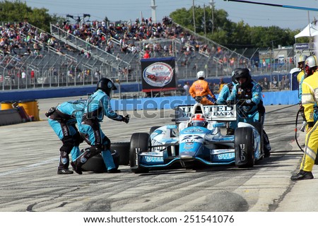 Milwaukee Wisconsin, USA - August 17, 2014: Verizon Indycar Series Indyfest ABC 250 pit stop action. 27 James Hinchcliffe Toronto, Canada United Fiber & Data Andretti Autosport, fuel and new tires