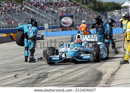 Milwaukee Wisconsin, USA - August 17, 2014: Verizon Indycar Series Indyfest ABC 250 pit stop action. 27 James Hinchcliffe, Canada United Fiber & Data Honda Andretti Autosport, gets fuel and new tires