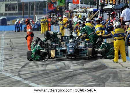 Milwaukee Wisconsin, USA - July 12, 2015: Verizon Indycar Series Indyfest ABC 250 at the Milwaukee Mile. Pit Stop action Ed Carpenter Indianapolis, Ind. Fuzzy's Vodka CFH Racing Chevrolet