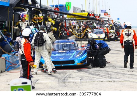 Elkhart Lake, Wisconsin USA - August 9, 2015: Road America road course, IMSA. The blue Chevrolet Corvette DP of VisitFlorida.com Racing makes a pit stop for fuel and tires.