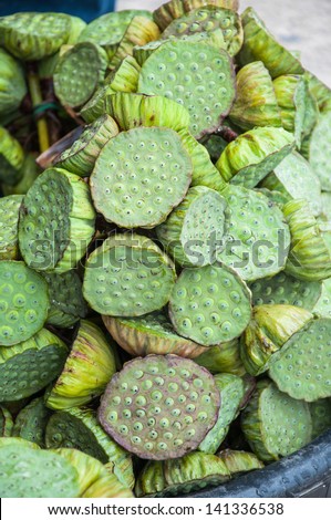 Lotus seed pods at street market in Thailand. The lotus seeds are of great importance to East Asian cuisine and are used extensively in  medicine and desserts.