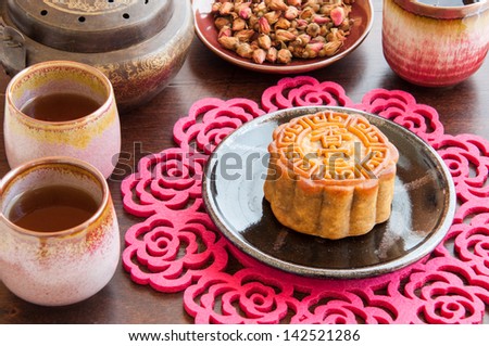 Chinese Moon Cake is the traditional dessert for Chinese Moon Festival with rose tea.