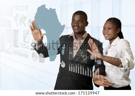 African business team working on virtual touchscreen