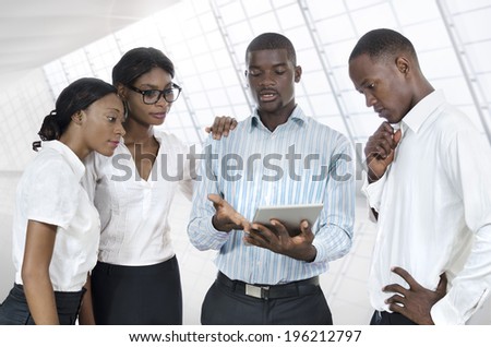 Four african business people with tablet PC, Studio Shot
