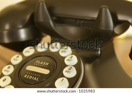 Tight in on a retro-styled telephone.