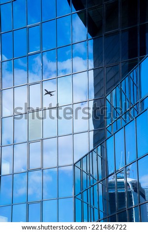 A jet airplane silhouette with business office towers , London, goal success concept