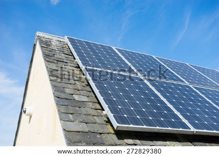 solar cell panel on house\'s roof, green energy