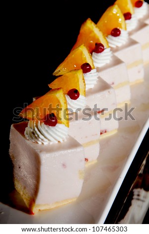 Row of orange cake