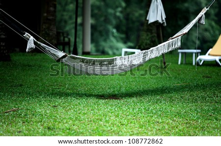White hammock in the shadow of the green glass.Thailand