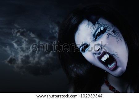 evil vampire woman beautiful halloween over night background