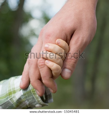 family  father and child son hands nature outdoor