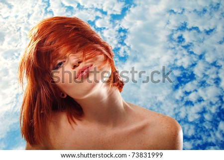 summer teen girl beautiful freckles redheaded over blue sky