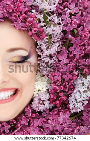 woman beautiful face with flower lilac frame