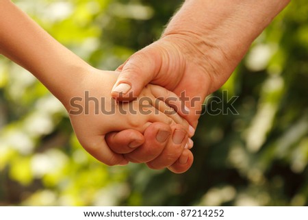 hands family grandson and old grandmother nature
