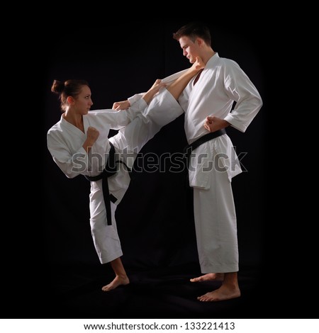 Fighting Karate Couple, Man And Woman With Black Belts - Champions Of ...