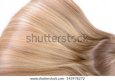 Hair and haircare. Beautiful blond female natural hair closeup