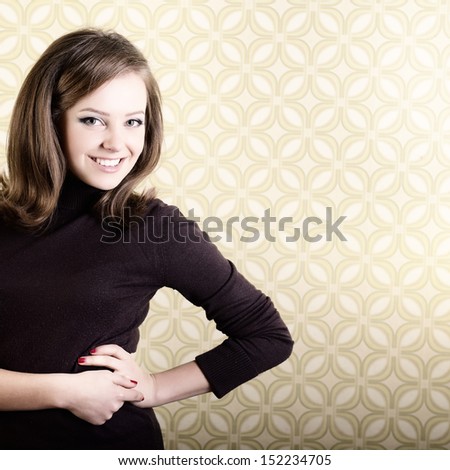 art portrait of young smiling ecstatic woman looking out at camera in room with vintage wallpaper, retro stylization 60-70s, toned and noise added