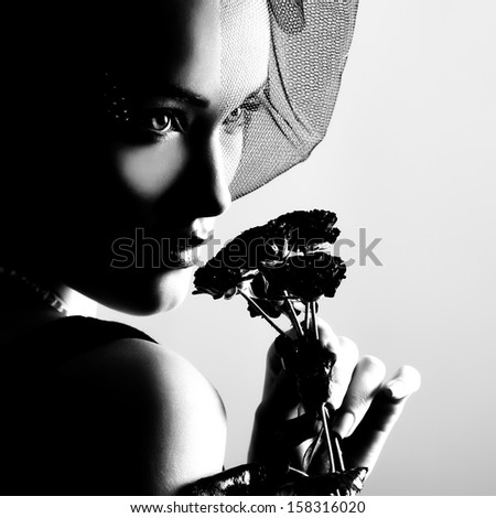portrait of beautiful young woman with flowers, black and white retro stylization