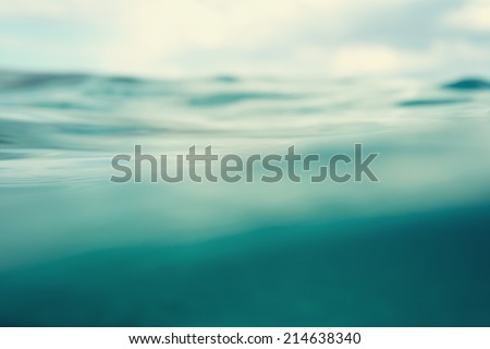 Water. Sea. Ocean, Wave close up. Nature background. Soft focus. Image toned and noise added.