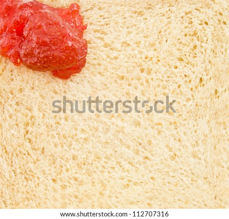 Close up texture red fruit jam paint on the bread