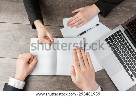 Solution controversial conflicts. Business playing Rock-paper-scissors during the negotiations. Top view. White notes, where you can place your text or information.