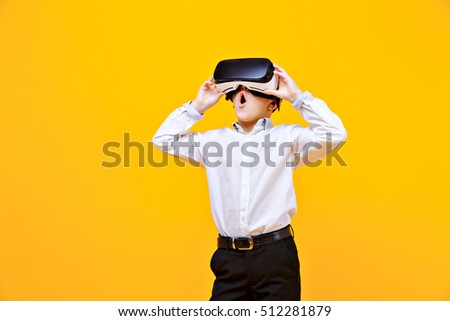 Similar – Image, Stock Photo Boy with virtual reality glasses on colorful background. Future technology, VR concept